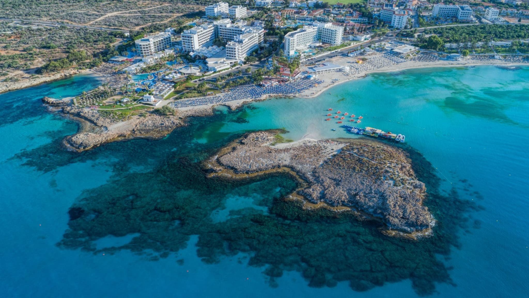 Плюсы минусы кипра. Нисси Бич. Nissi Beach Кипр. Айя Напа Ибица. Пафос Кипр вид сверху.